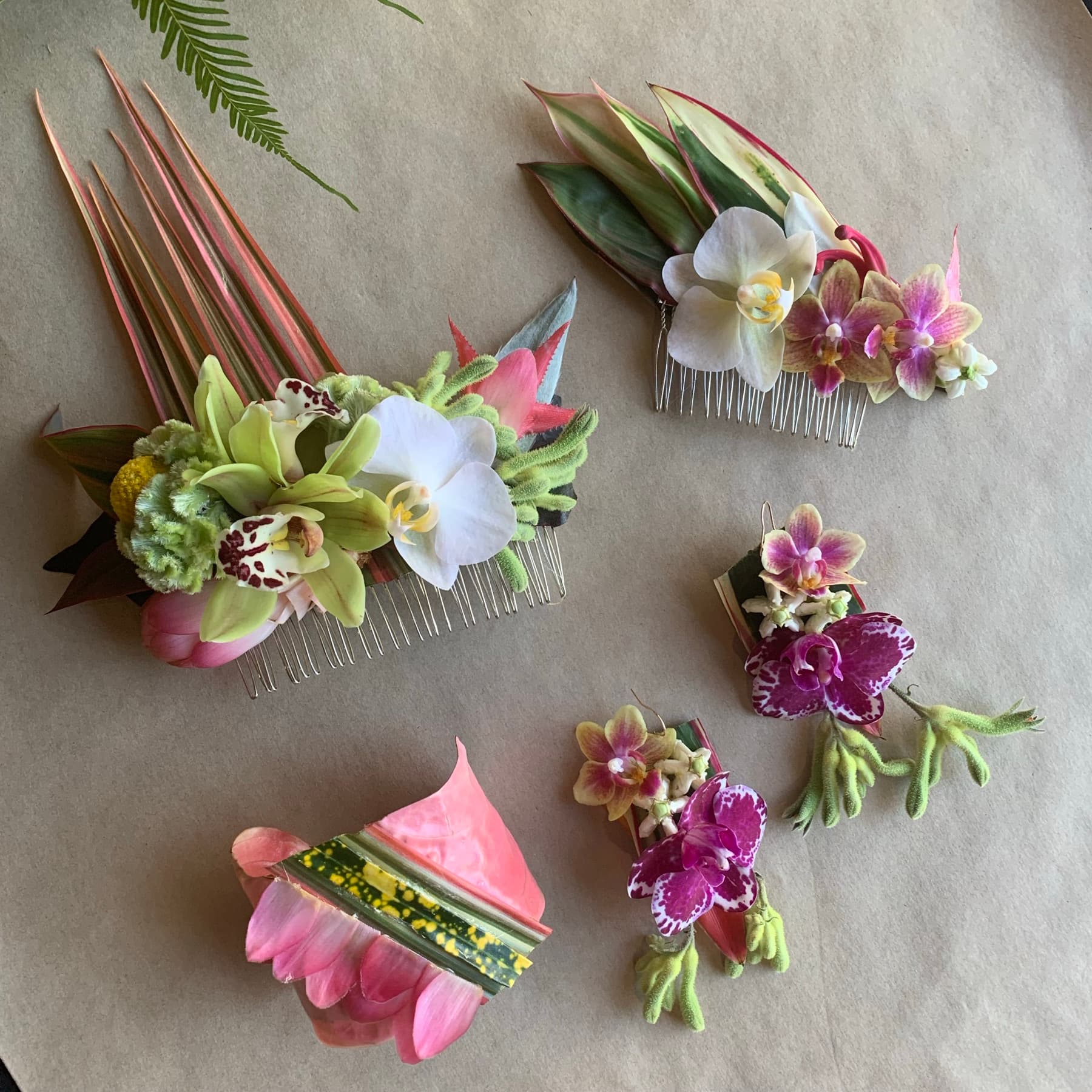 Orchid and leaf floral design